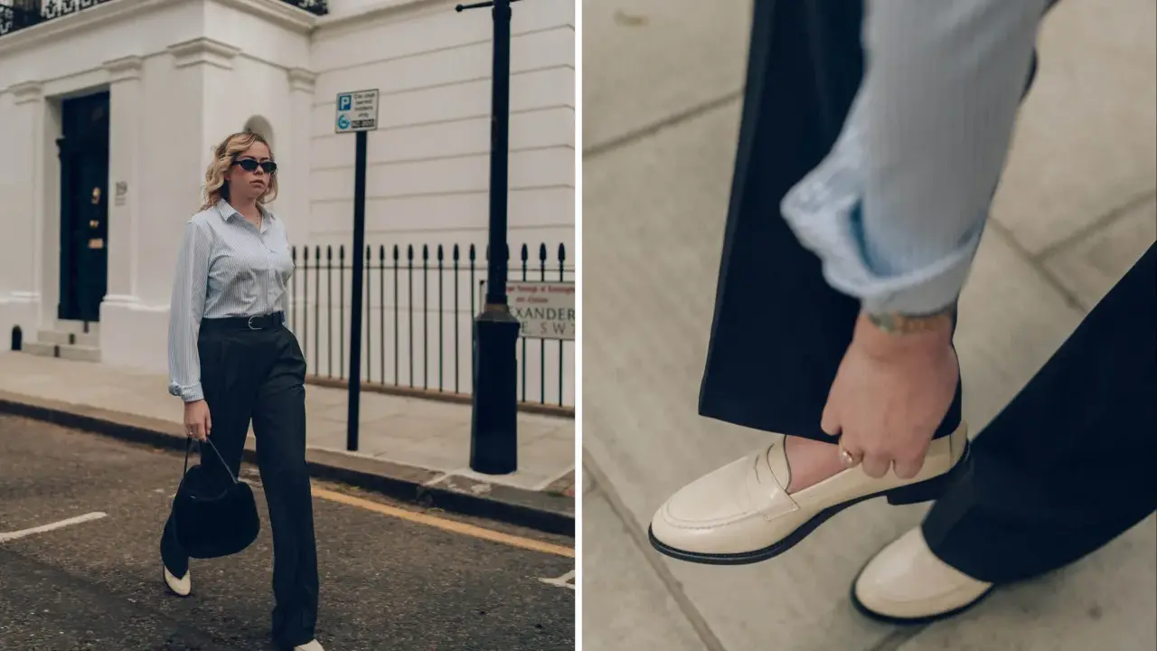 Schicke Loafer sind die perfekte Wahl für 3/4 Hosen. Eine Frau in einem gestreiften Hemd und dunklen Hosen trägt cremefarbene Loafer.