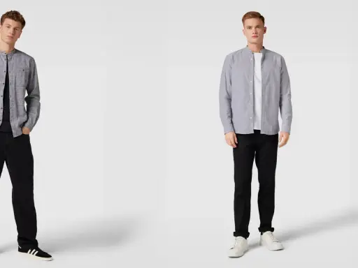 Zwei Männer in grauen Hemden mit Stehkragen und schwarzen Hosen. Welches graues Hemd passt besser zum Anzug?